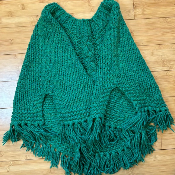 Hand knit fringed girl’s poncho. Cables centered on front and back, front pouch. - Picture 2 of 8